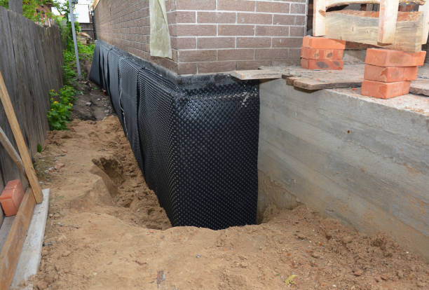 Happy homeowners after waterproofing job in Jacksontown